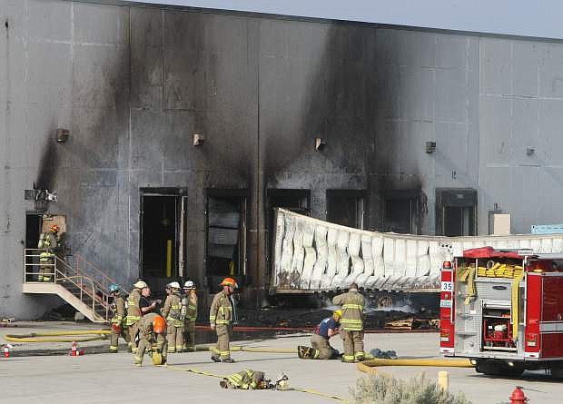Firefighters respond to a fire at Clark Associates near the Dayton Airpark on Tuesday afternoon.