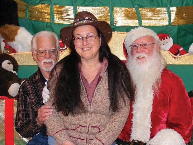 Fred and Maxine Nietz meet with Santa after a successful tree lighting event.