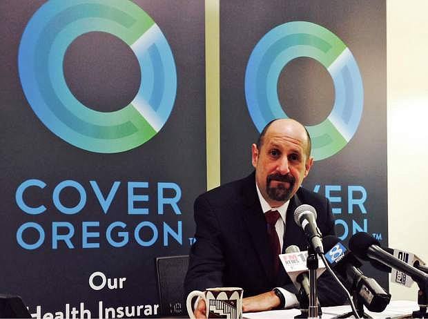 FILE - This Dec. 10, 2013, file photo shows Cover Oregon Executive Director Dr. Bruce Goldberg at a news conference at Cover Oregon headquarters in Durham, Ore. With the open enrollment deadline approaching, some states running their own health insurance exchanges are focused less on getting robust sign-ups than on avoiding total disaster. Nevada, Massachusetts, Vermont, Maryland and Oregon are among the states facing severe technical and administrative problems, which have led to firings of top officials and contract cancellations for key software companies.(AP Photo/Gosia Wozniacka, File)