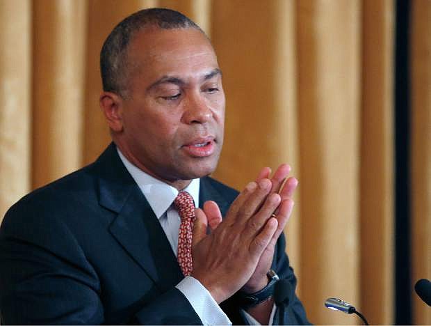 In this March 24, 2014 file photo, Massachusetts Gov. Deval Patrick reacts as he speaks at a leadership forum in Boston. The state that served as a template for President Barack Obama&#039;s Affordable Care Act had significant trouble coordinating with the federal government. The Massachusetts state-run health insurance website, designed by the same contractor that worked on the troubled federal website, performed so poorly that it prompted a public apology from Gov. Patrick. (AP Photo/Elise Amendola, File)