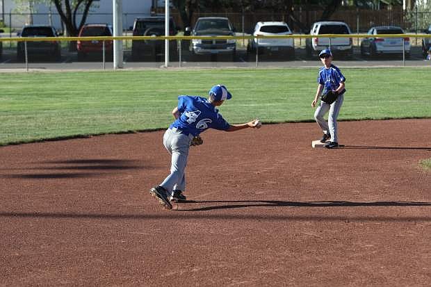 Shortstop Brian Gutherie throws a ball to second baseman Jacob Pettay in a game against Reno Centennial on Saturday.