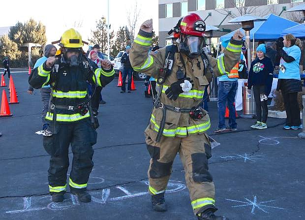 Carson City firefighters Cameron Burt and Jason Danen completed the 5k in full gear Saturday. East Fork firefighters graciously covered the south Carson crew so they could attend the event.