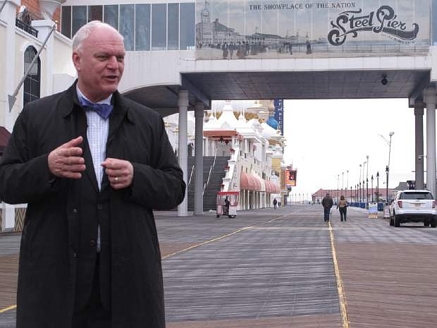 This March 11, 2015 photo shows Mayor Don Guardian on the Atlantic City, N.J. Boardwalk _ the most valuable spot on the Monopoly board game. The game turns 80 years old on March 19, 2015. (AP Photo/Wayne Parry)