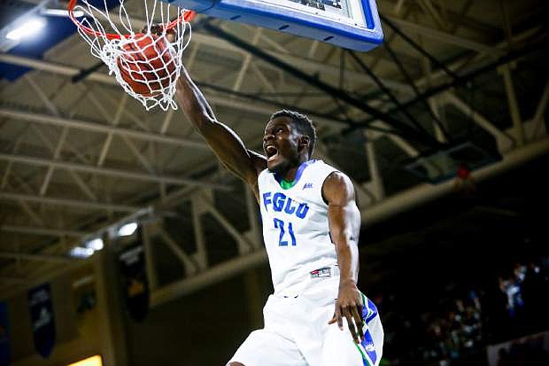 FILE- In this March 6, 2016, file photo, Florida Gulf Coast&#039;s Demetrius Morant dunks against Stetson during the first half of the NCAA college Atlantic Sun Basketball championship game Sunday, March 6, 2016, in Fort Myers, Fla. Florida Gulf Coast is one of eight teams whose tournaments are starting a little bit before the first round of the college basketball NCAA Tournament officially opens Thursday, March 17.  (Scott McIntyre/Naples Daily News via AP, File)  FORT MYERS OUT; MANDATORY CREDIT