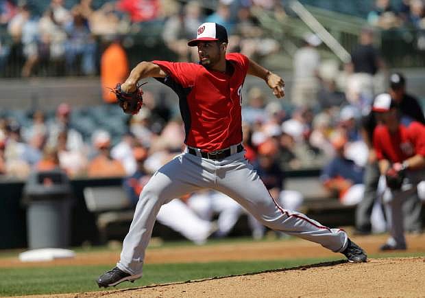 Washington Nationals pitcher Gio Gonzalez throws against the Houston Astros during the first inning of an exhibition spring training baseball game Thursday, March 7, 2013, in Kissimmee, Fla. (AP Photo/David J. Phillip)