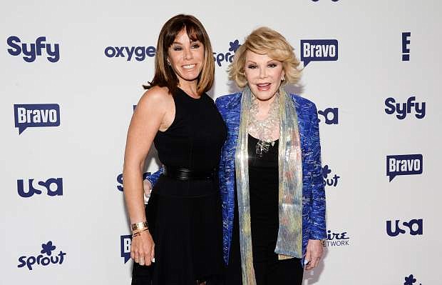 FILE - In this May 15, 2014 file photo, Melissa Rivers, left, and Joan Rivers attend the NBCUniversal Cable Entertainment 2014 Upfront at the Javits Center in New York. Melissa Rivers filed a malpractice lawsuit Monday, Jan. 26, 2015, against doctors and the clinic where her mother Joan Rivers had a routine medical procedure, stopped breathing, and later died. Rivers said in a statement that filing the suit was one of the most difficult decisions she had to make. (Photo by Evan Agostini/Invision/AP, File)