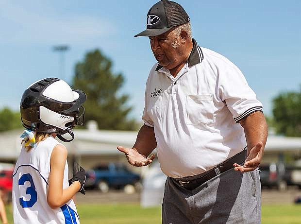 Umpire Richard Pitts works a softball tournament in Reno. Pitts has been officiating game for more than 60 years.