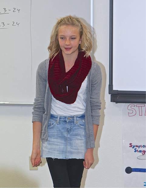 10th grader Sarah Sever recites her poem Wednesday at Carson High during the Poetry Out Loud competition.