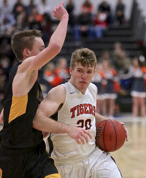 Douglas&#039; Dalton Davis drives to the bucket against Galena Friday night at Keith Green Court. The Tigers would lose to the Grizzlies in overtime.