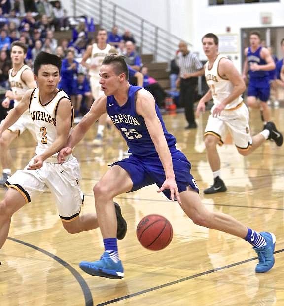 Jayden DeJoseph drives to the hoop Friday night against Galena.
