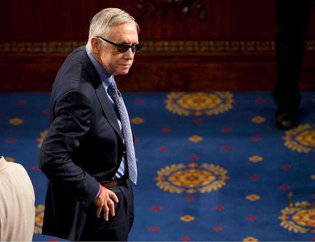 FILE  In this March 25, 2015 file photo, Senate Minority Leader Harry Reid of Nev. waits on the floor of the House Capitol Hill in Washington for the arrival of Afghanistan&#039;s President Ashraf Ghani, who was to speak before  a joint meeting of Congress. Reid is announcing he will not seek re-election to another term. The 75-year-old Reid says in a statement issued by his office Friday that he wants to make sure Democrats regain control of the Senate next year and that it would be &quot;inappropriate&quot; for him to soak up campaign resources when he could be focusing on putting the Democrats back in power. (AP Photo/Pablo Martinez Monsivais, File)