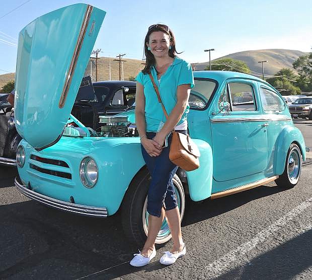 Nova Lumadue of Minden poses with her 1959 Volvo 544 Friday during the Silver Dollar Classic Car Show at the Max Casino. Ms. Lumadue has owned the car since she was 13 years old and has been restoring it over the years. This is the 2nd time she has shown the Volvo.