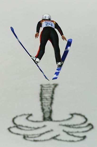 France&#039;s Coline Mattel makes her first attempt during the women&#039;s normal hill ski jumping final at the 2014 Winter Olympics, Tuesday, Feb. 11, 2014, in Krasnaya Polyana, Russia. (AP Photo/Gregorio Borgia)