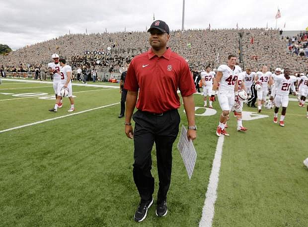Stanford head coach David Shaw walks on the field after his team&#039;s 34-20 win over Army in an NCAA college football game on Saturday, Sept. 14, 2013, in West Point, N.Y.(AP Photo/Mike Groll)