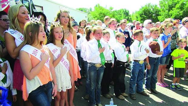 Our future farmers, 4-H kids and local beauty queens share a patriotic moment at the NV150Fair.