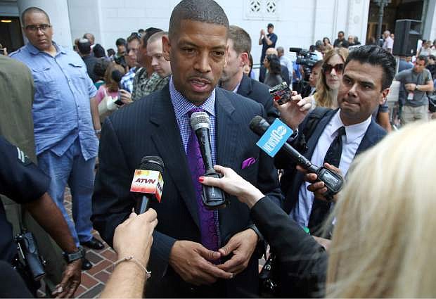 In this photo taken on April 29, 2014, Sacramento, Calif., Mayor Kevin Johnson speaks to reporters after his comments about the penalties imposed on Los Angeles Clippers owner Donald Sterling by the NBA at a news conference at Los Angeles City Hall. Last year Johnson almost single-handedly kept the Kings NBA franchise in Sacramento, staging a late-game comeback to snatch the team away from a Seattle billionaire. This spring he began raising his national political profile by taking over as the head of the U.S. Conference of Mayors, then acting as spokesman for the NBA players as the controversy over racist remarks by the Clippers&#039; owner threatened to throw the basketball league into turmoil. (AP Photo/Nick Ut)