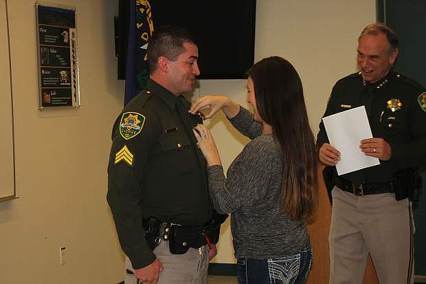 Deputy Matt Smith gets promoted to sergeant with the Carson City Sheriff&#039;s Office as his wife Yolanda pins on his badge Monday.