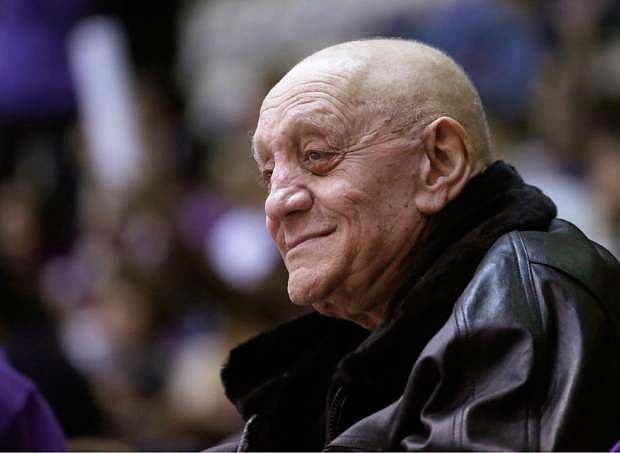 FILE - In this Dec. 17, 2012, file photo, former UNLV basketball coach Jerry Tarkanian watches his granddaughter, Northwestern center Dannielle Diamant, during Northwestern&#039;s NCAA college basketball game against California in Evanston, Ill. Hall of Fame coach Jerry Tarkanian, who built a basketball dynasty at UNLV but was defined more by his decades-long battle with the NCAA, died Wednesday, Feb. 11, 2015, in Las Vegas after several years of health issues. He was 84. (AP Photo/Charles Rex Arbogast, File)