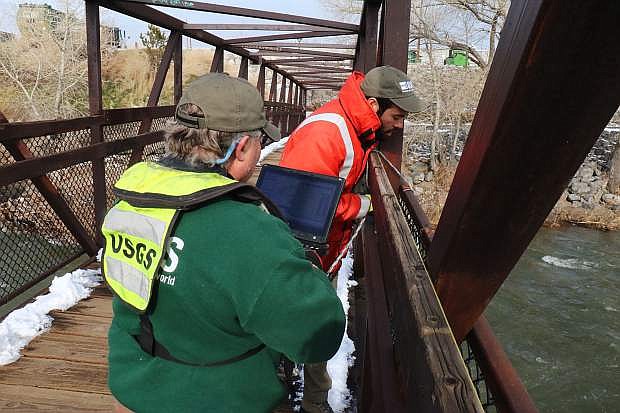 On Tuesday at John Champion Park in Reno, USGS Hydrotechs Emil Stockton and Kristopher Ross are measuring the Truckee River with an ADCP machine to collect volume of water, and post results on the website.