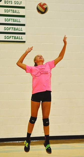 Lady Wave junior Whitney Skabelund throws up a serve in preparation for the upcoming season.