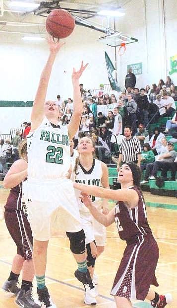 Caitlyn Welch leaps for the basket during the Lady Wave&#039;s home game against Dayton.