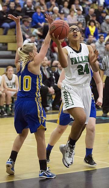 Fallon&#039;s Leta Otuafi drives past Lowry&#039;s Caitlynn Cooper Saturday afternoon in Reno.