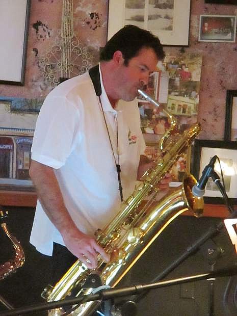 Baritone sax player, Casey Finnerty, with Mile High Jazz Band at Comma Coffee last month.