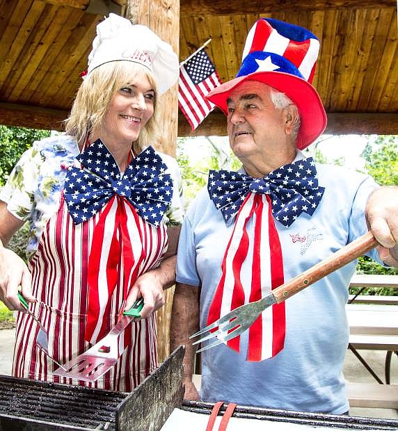 Douglas County Democratic Central Committee Chair Kimi Cole and member Gim Hollister are ready to cook tri-tip to perfection at the Douglas County Democrats annual picnic July 25 in Mormon Station Park, Genoa.
