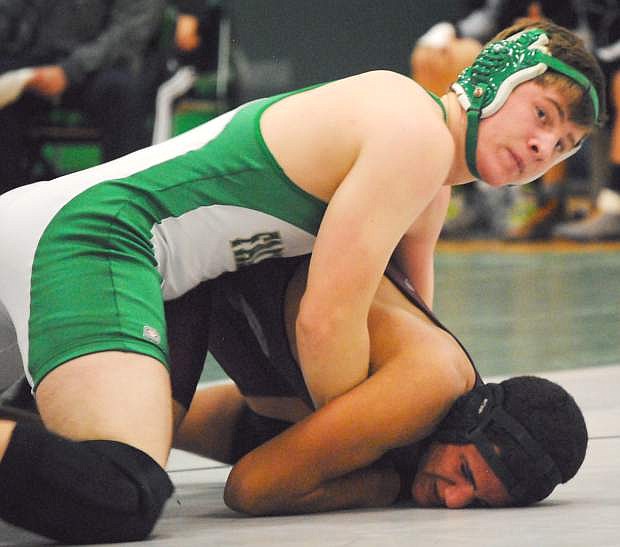 Greenwave grappler David Hughes, on top, works for a pin during his bout at the Earl Wilkens Memorial Tournament on Saturday. Fallon will compete today and Saturday at the Cody Louk Invitational in Winnemucca.