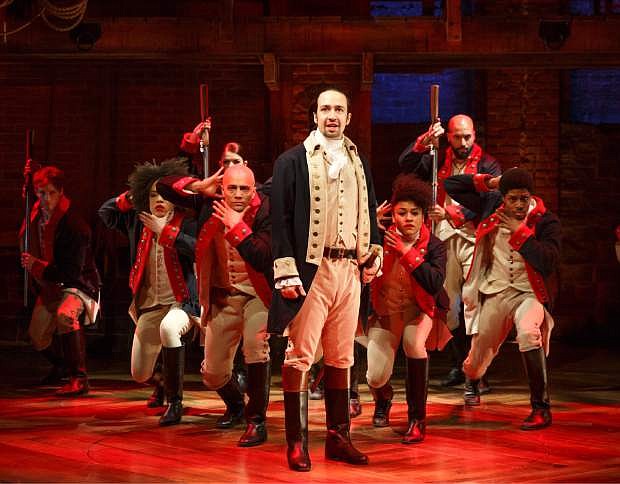 This image released by The Public Theater shows Lin-Manuel Miranda, foreground, with the cast during a performance of &quot;Hamilton,&quot; in New York.  (Joan Marcus/The Public Theater via AP)