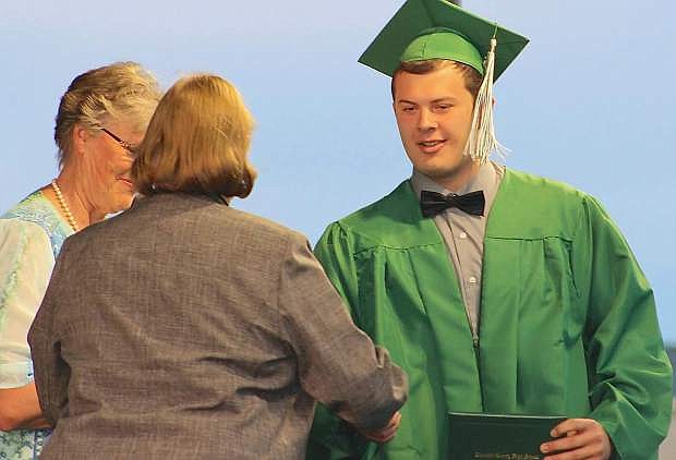 David Ford receives his diploma from Dr. Sandra Sheldon, superintendent of Churchill County schools.