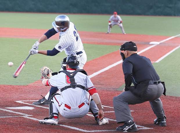 Austin Byler strokes a pitch for Nevada on Friday.