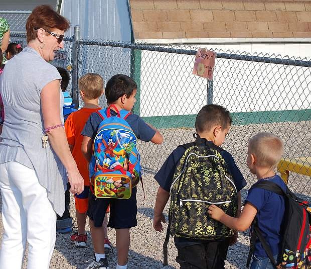 Mary Rudden, an instrutional aide at Northside Early Learning Center, lines up students before Tuesday&#039;s first bell rings.