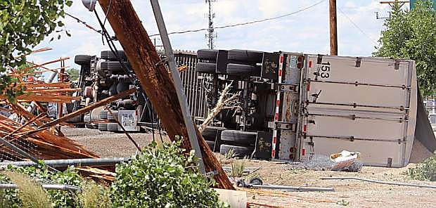 An 18-wheeler flipped on its side west of Fallon Friday morning.