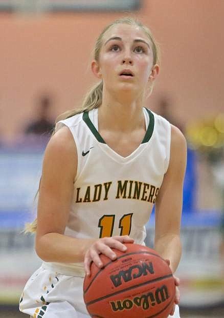 Manogue freshman Kenna Holt concentrates at the foul line in a semi-final matchup against Reed Friday night at Carson High. The Miners would win the game 62-45.