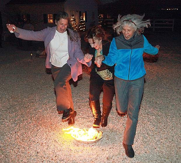 Attendees of an annual fundraiser for local veterans jump the fire in the traditional Persian New Year celebration, which will return to Carson City on March 21.