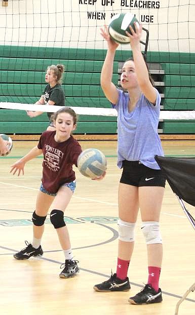 Lacee Wallace, left, and Hailey Guerrero work on a drill during a CCMS volleyball practice.