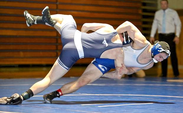 Seth Reichelt goes to the mat with Damonte&#039;s Cade Stilson in tow Thursday night during a 152 lb. match at Morse Burley Gym.