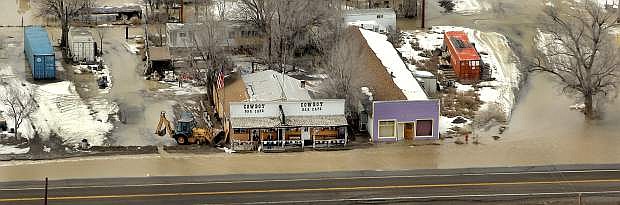 In a Wednesday, Feb. 8, 2017 photo, the town of the town of Montello, Nev., is flooded after 21 Mile Dam broke, and forced delays or rerouting for more than a dozen freight and passenger trains on a main rail line that runs through the area, said Union Pacific spokesman Justin E. Jacobs. (Stuart Johnson/ The Deseret News via AP)/The Deseret News via AP)