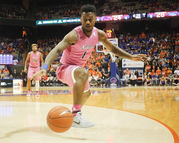 Nevada&#039;s Marcus Marshall reaches for a loose ball during the first half of an NCAA college basketball game against Boise State in Boise, Idaho, Wednesday, Jan. 25, 2017. Nevada won 76-57. (AP Photo/Otto Kitsinger)