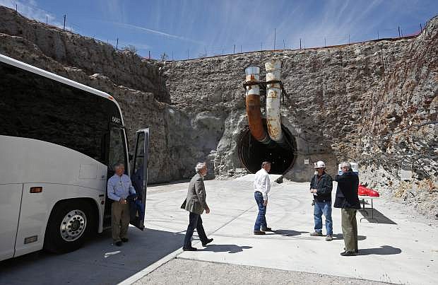 FILE - In this April 9, 2015 file photo, congressmen arrive at the south portal of Yucca Mountain during a congressional tour near Mercury, Nev. Facing a new presidential administration and a Republican-controlled Congress without now retired Sen. Harry Reid, Nevada officials are gearing up to resume a 30-year fight to stop a federal proposal to bury the nation&#039;s nuclear waste about 100 miles northwest of Las Vegas, though some local officials who live near the site aren&#039;t on the same page. (AP Photo/John Locher,File)
