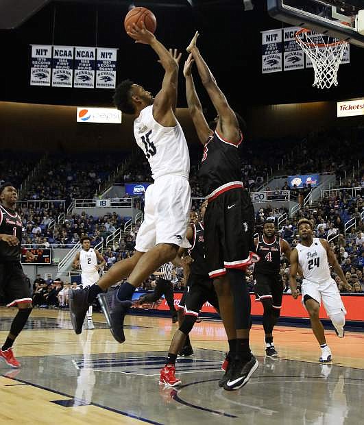 D.J. Fenner goes up for a shot against Fresno State at Lawlor Events Center earlier this season.