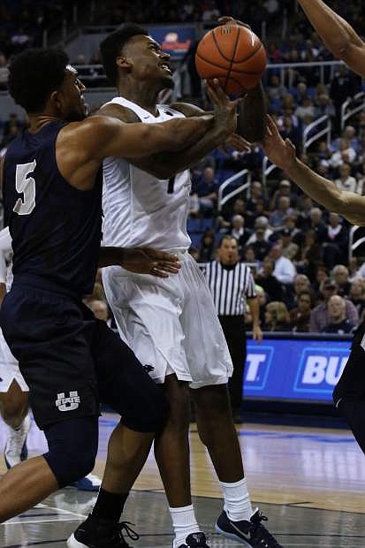 Nevada&#039;s Marcus Marshall gets fouled while shooting against Utah State on Saturday at Lawlor Events Center.