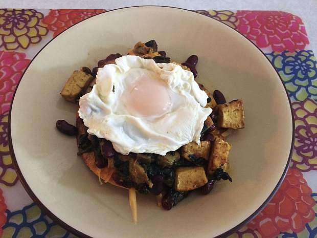 Winter hash is layered over a crispy corn tortilla and topped with a poached egg.