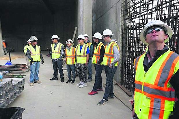 A Western Nevada College construction class is given a tour of a job site by Garrett Kooyers from K.G. Walters Construction.