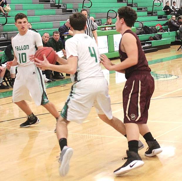 John Cooley passes the ball to Dalton Kaady during a Greenwave home game earlier this season.