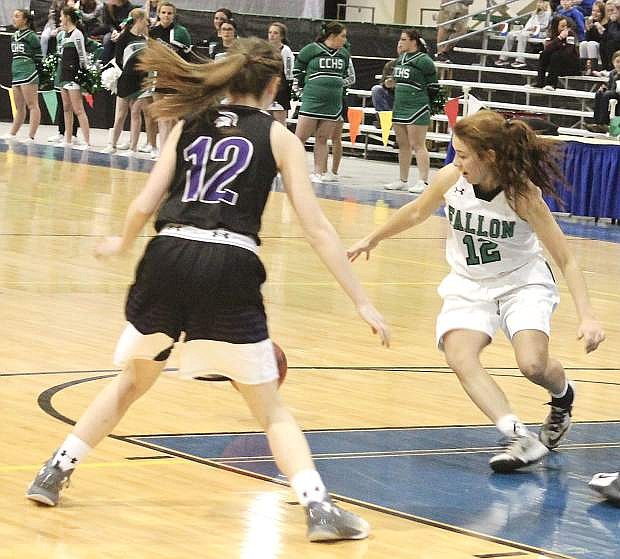 Alexis Jarrett, right, races Spring Creek&#039;s Delayanne Walz to grab the ball during the Northern 3A regional tournament.