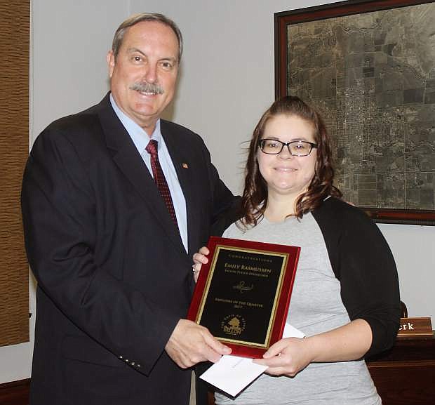 Fallon Police Department dispatcher Emily Rasmussen receives her city employee of the quarter award from Mayor Ken Tedford in a special ceremony last week.