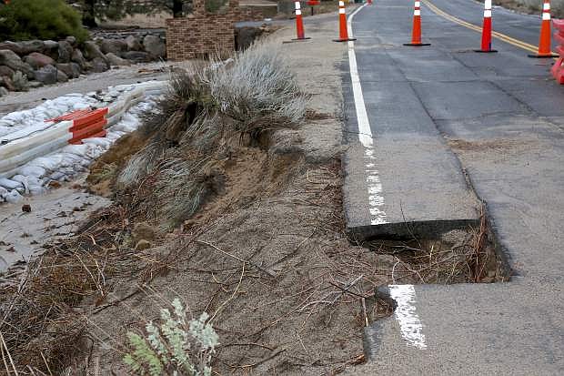 Combs Canyon Rd. has a section of pavement missing Friday due to floodwaters.