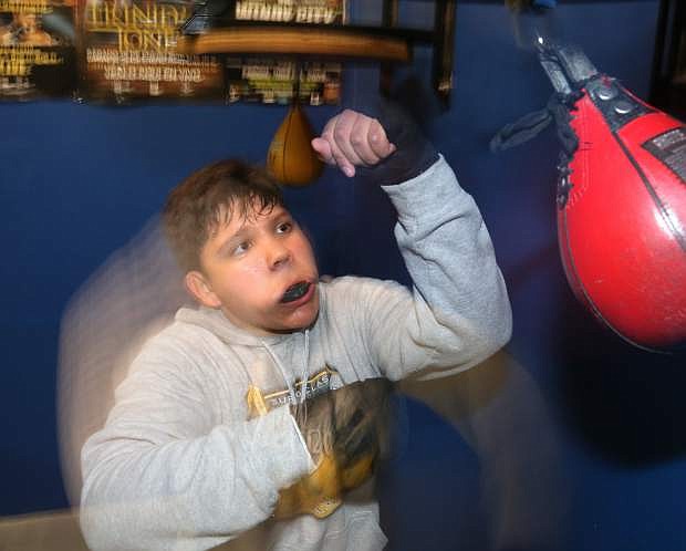 Carson Middle School student Jerry DeLeon, 13, hits a speed bag at the Carson City Boxing Club on Tuesday night.